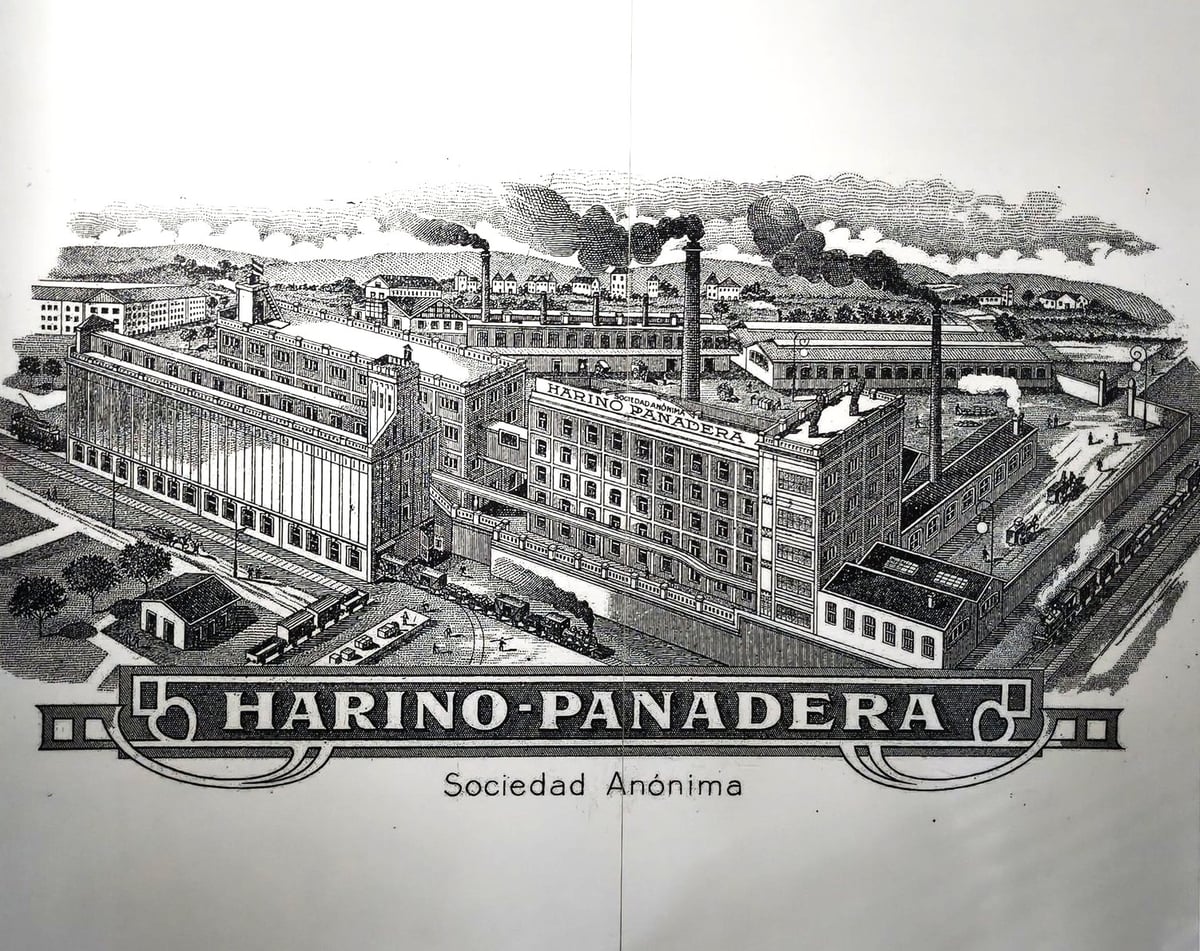 Grabado antiguo de la fábrica de Harino Panadera a pleno rendimiento, a principios del siglo XX
